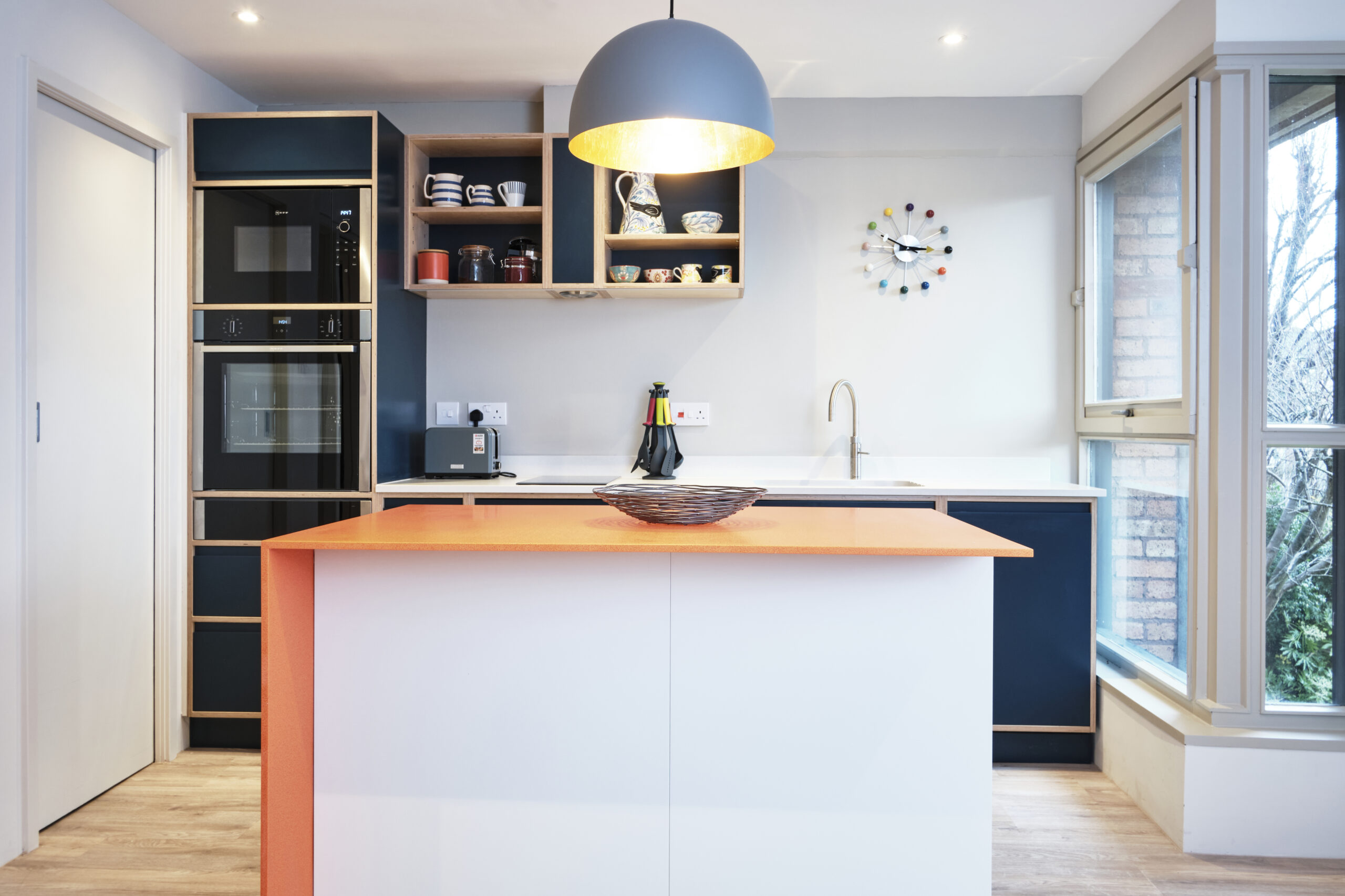 Contemporary Ply Edge Kitchen in Blue, Grey and Orange